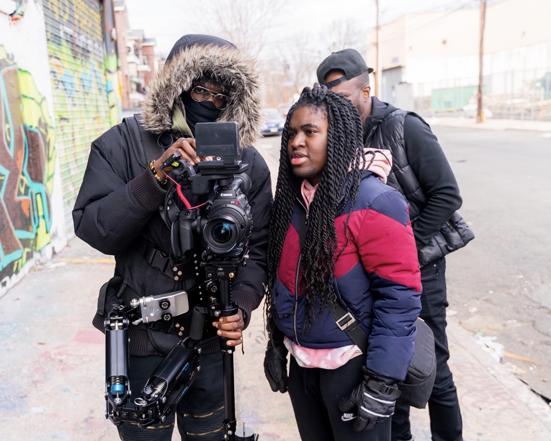 Kay The Kreator, Director of “Dedication” on set in Newark with Lionel Djaowe (DP) and Stan J. Adams (Actor). Photo Credit: Andrew Rose.