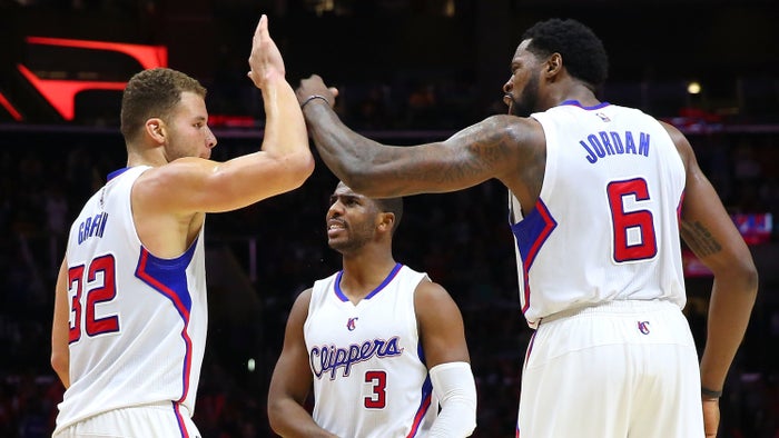 Blake Griffin of the Los Angeles Clippers celebrates with teammates Chris Paul and DeAndre Jordan