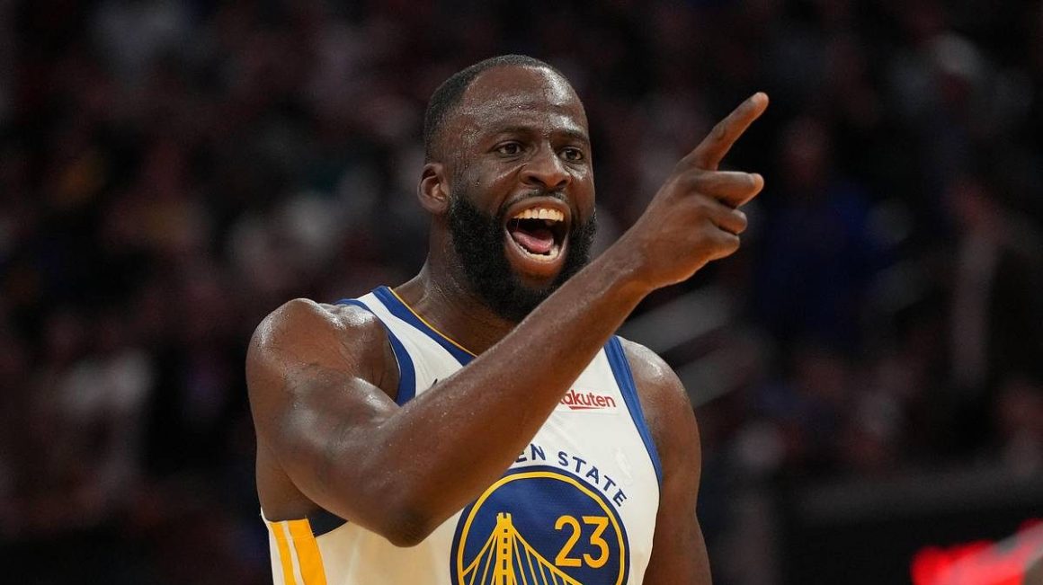 Draymond Green points while reacting during a Golden State Warriors game in April 2026
