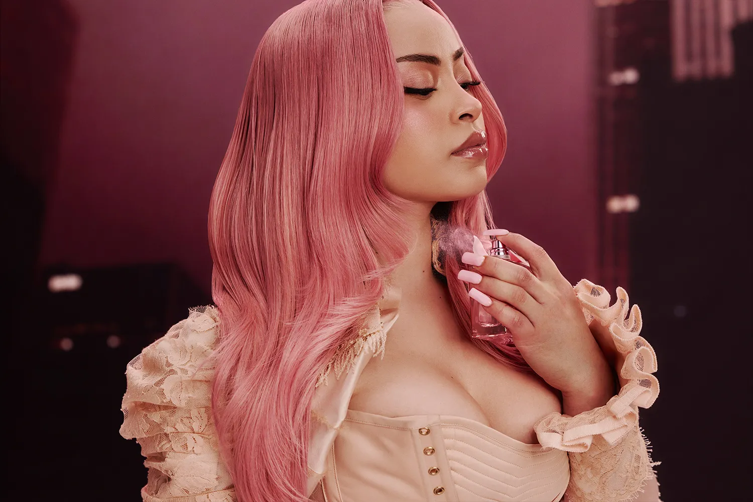 Ice Spice spraying her In Ha Mood fragrance