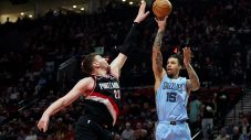 Brandon Clarke shoots over Donovan Clingan during a Memphis Grizzlies game against the Portland Trail Blazers.