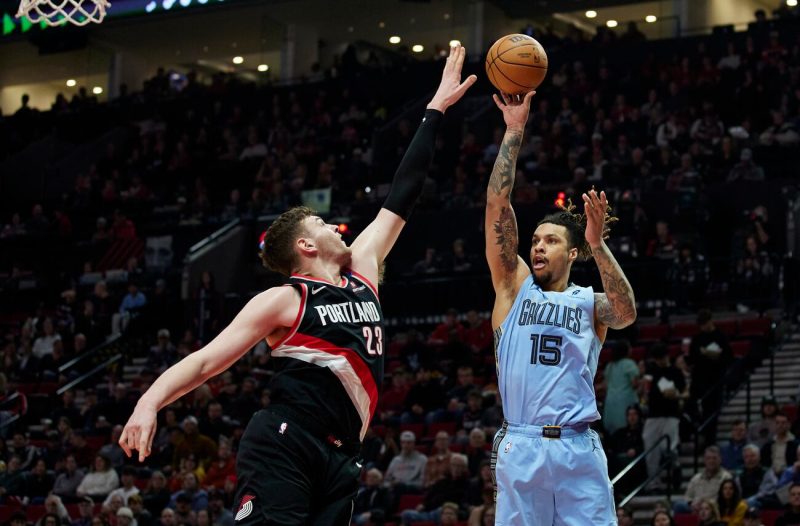 Brandon Clarke shoots over Donovan Clingan during a Memphis Grizzlies game against the Portland Trail Blazers.