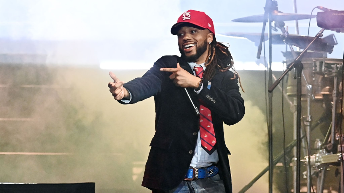 Metro Boomin performing in a red cap at HBCU AWARE FEST in Atlanta