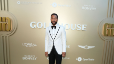 John Legend in a white dinner jacket at the 2026 Gold Gala in Los Angeles