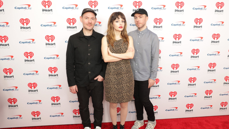 CHVRCHES - INGLEWOOD, CALIFORNIA - JANUARY 14: (L-R) Iain Cook, Lauren Mayberry, and Martin Doherty of CHVRCHES attend the 2023 iHeartRadio ALTer EGO at The Kia Forum on January 14, 2023 in Inglewood, California. (Photo by Momodu Mansaray/Getty Images)